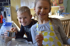 Cooking with Children- Two kids helping cook